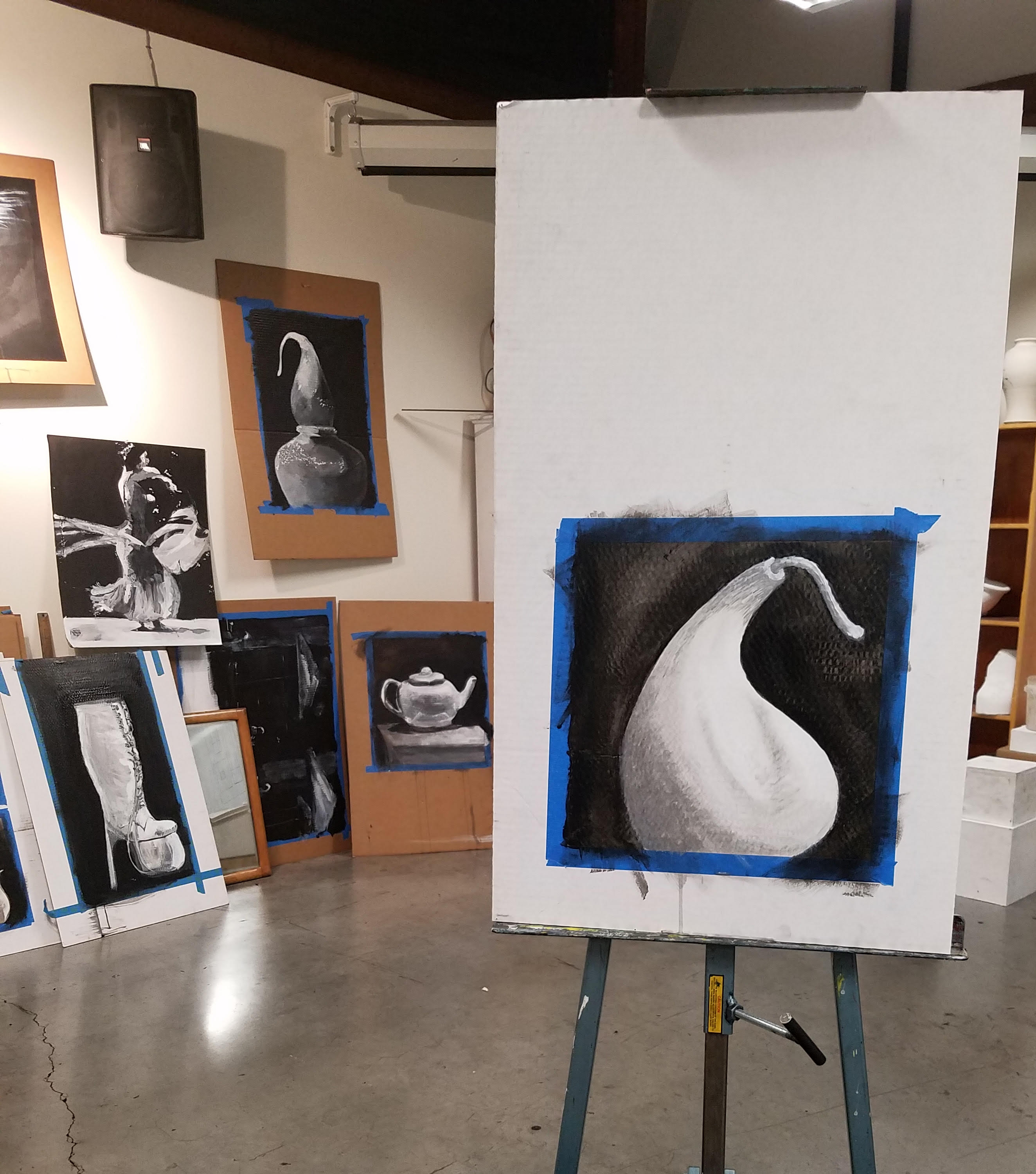 stuido with black and white paintings