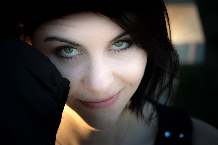 a young woman holding a graduation hat