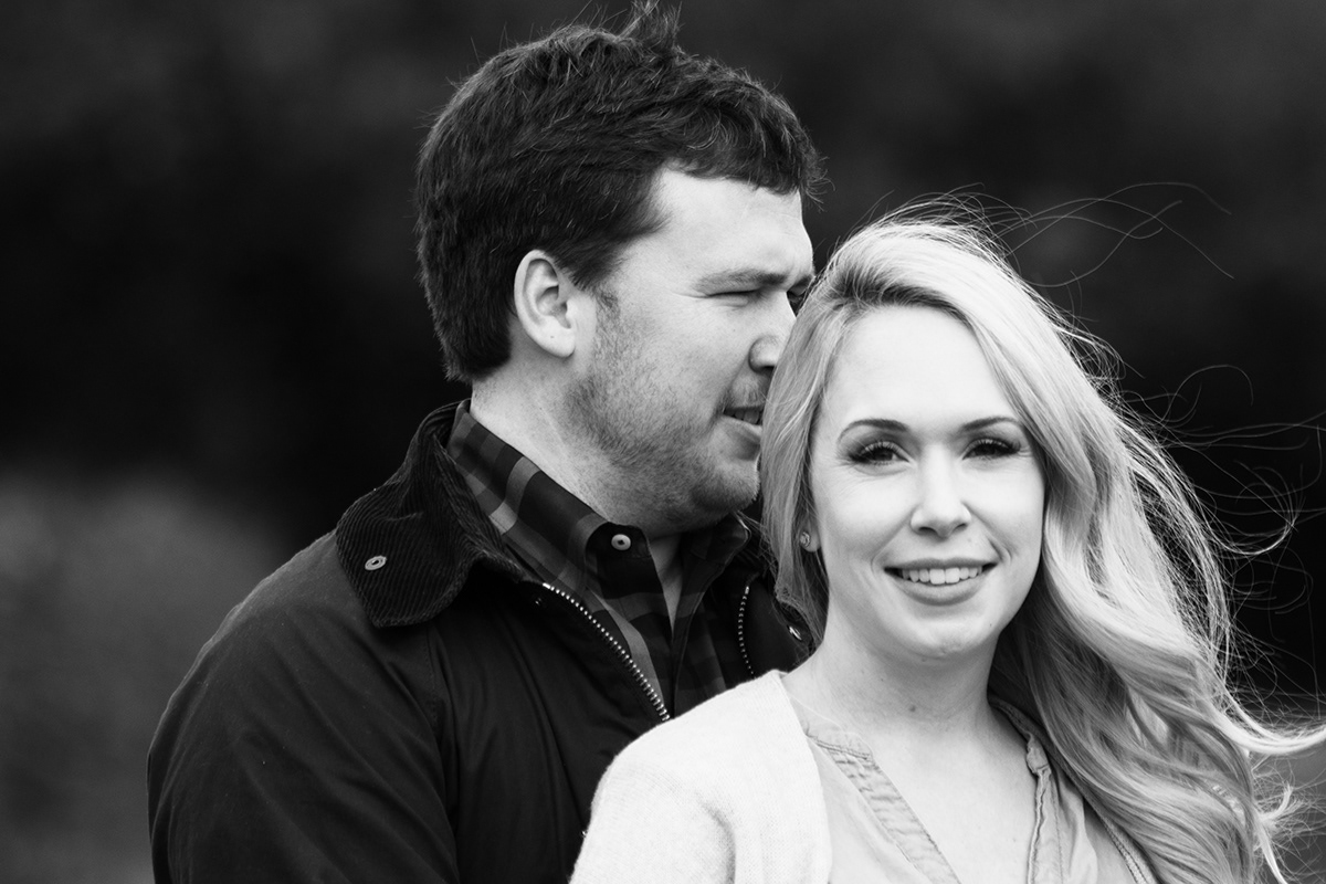 young cuople with hubby looking off into distance