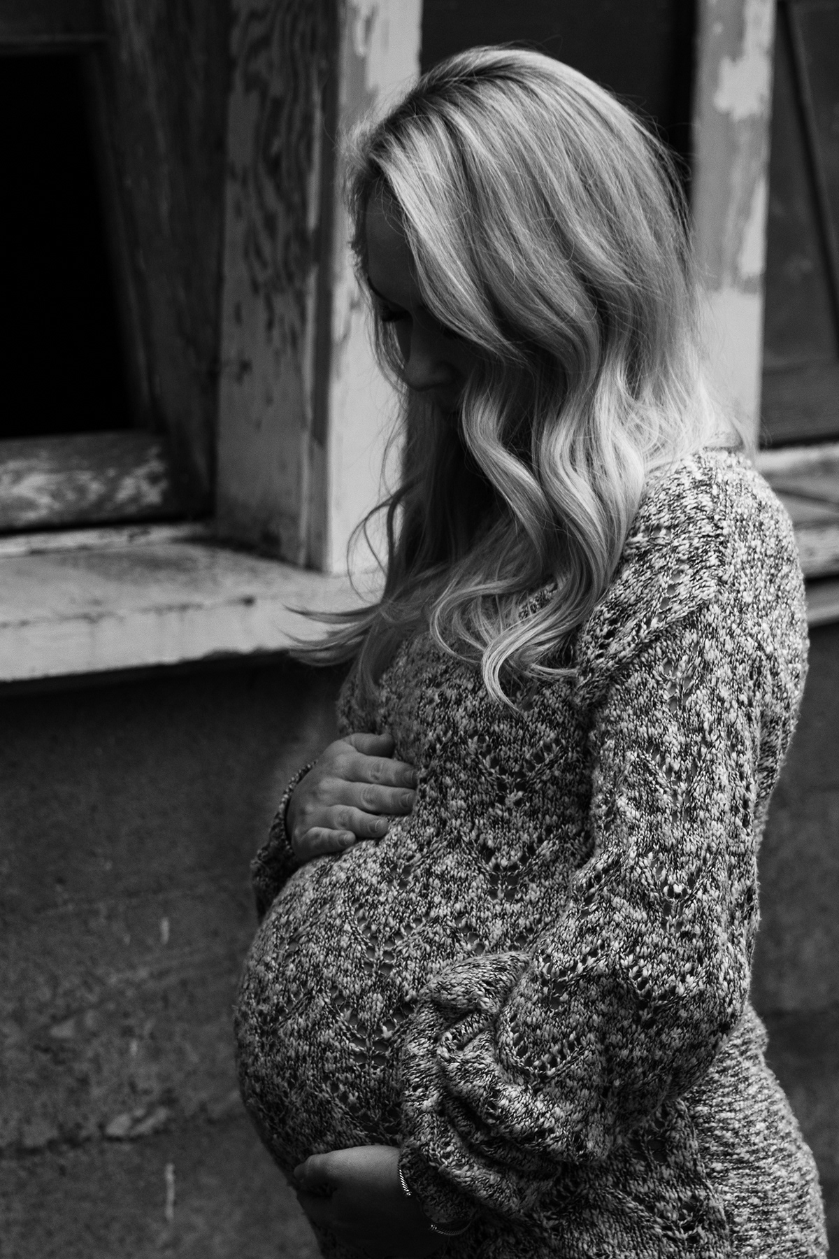 woman holding her baby bump